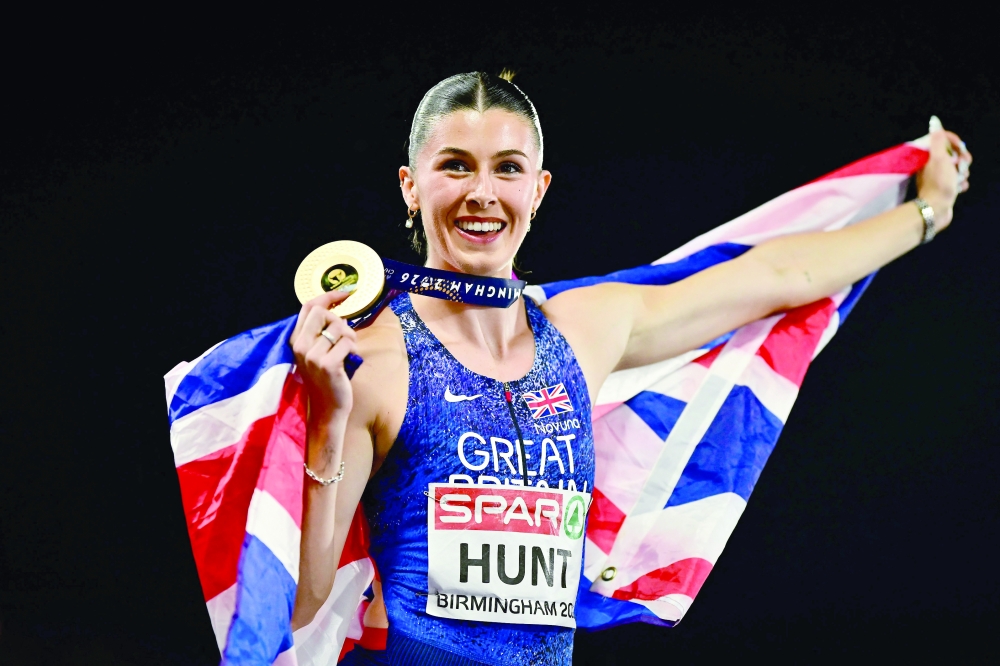 Gold medallist Britain's Amy Hunt celebrates after winning in the women's 200m final during the European Athletics Championships at Alexander Stadium in Birmingham on August 13, 2026.