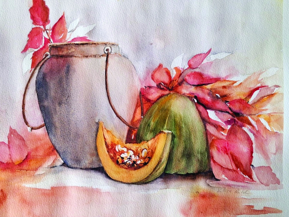 Autumn still life with a rustic pot, ripe papaya and warm falling leaves