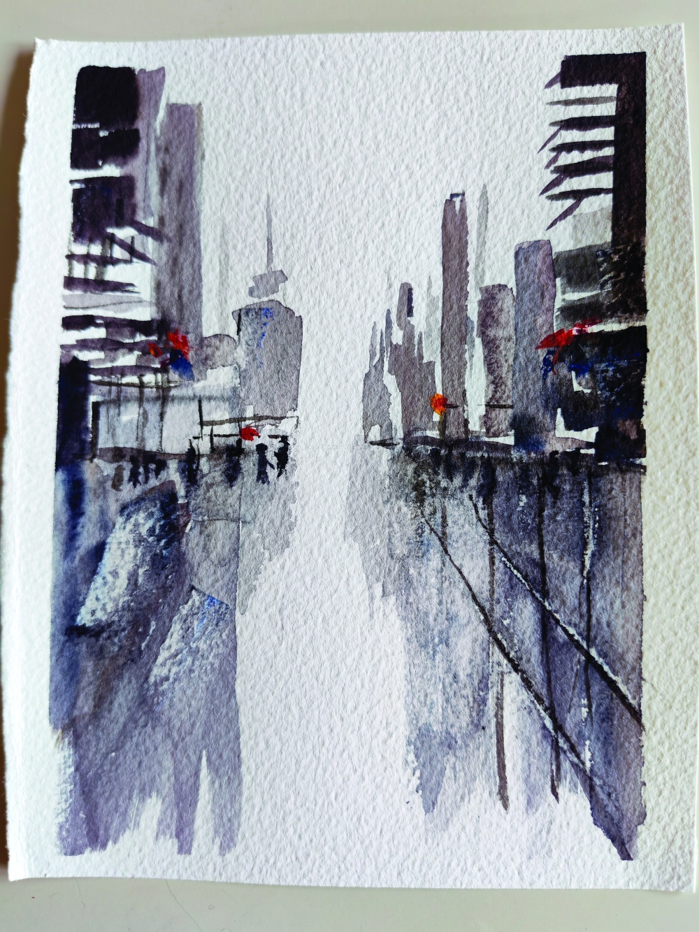 Rainy city street with red accents and distant figures