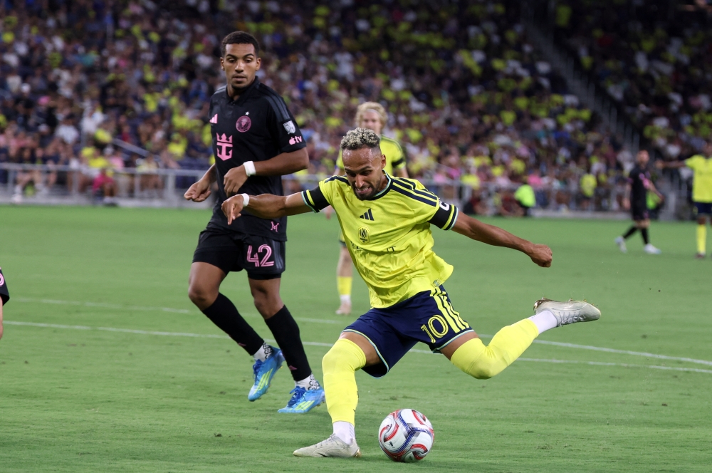  Nashville SC midfielder Hany Mukhtar (10) shoots and scores past Inter Miami CF forward Yannick Bright (42)  