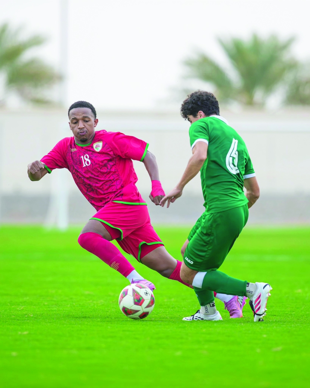 The young Red Warriors battle for possession during their 2-1 friendly defeat to Syria.