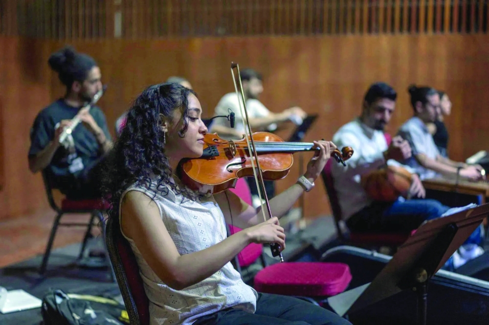 Palestinian musicians take part in a final rehearsal before the opening of the Jerusalem Festival, held at the Yabous Cultural Centre after a two-year hiatus, in East Jerusalem. — AFP