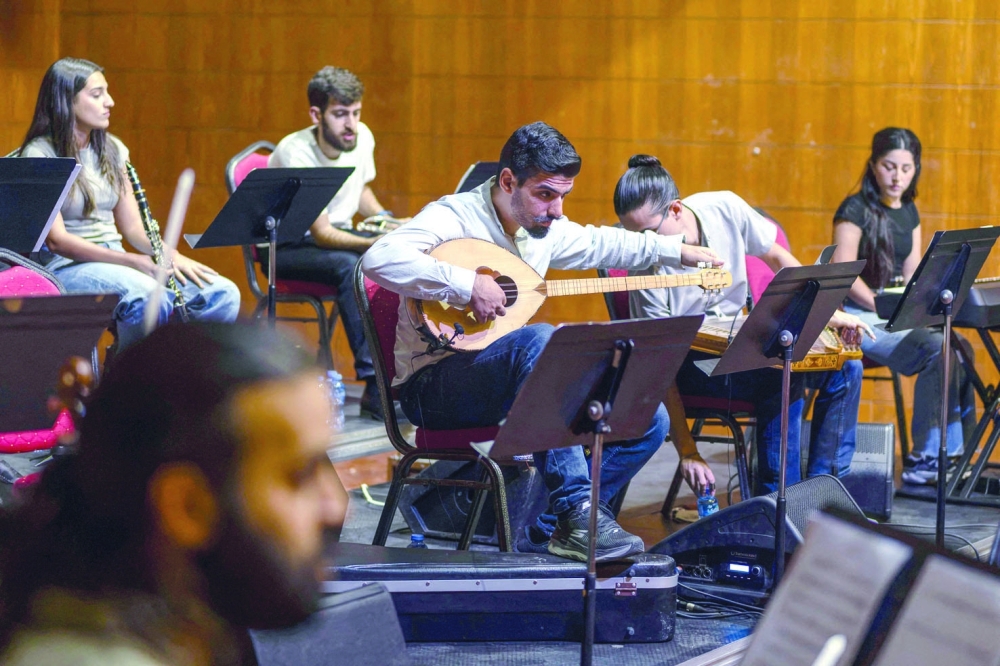Palestinian musicians take part in a final rehearsal before the opening of the Jerusalem Festival, held at the Yabous Cultural Center after a two-year hiatus, in East Jerusalem. — AFP