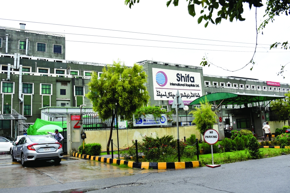 A car enters Shifa International Hospital after the Supreme Court moved former PM Imran Khan to the hospital in Islamabad. — Reuters