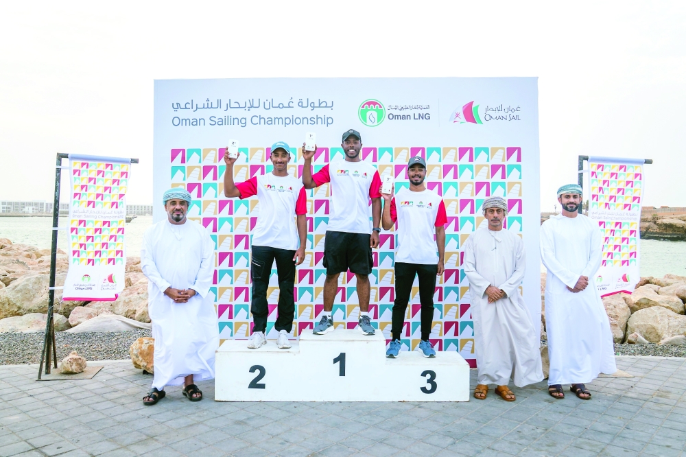 The top three finishers in the ILCA 7 class.