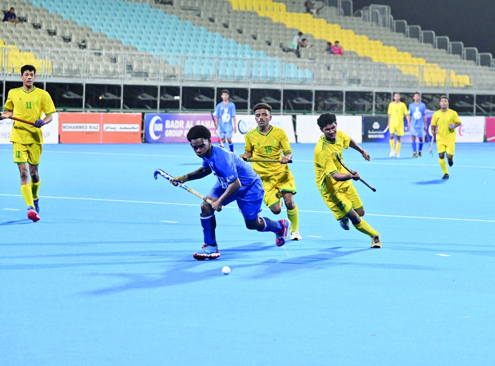 Seeb and Al Amerat players battle for possession during their Junior Hockey League encounter at Hockey Oman Stadium. — Hussein al Muqbali