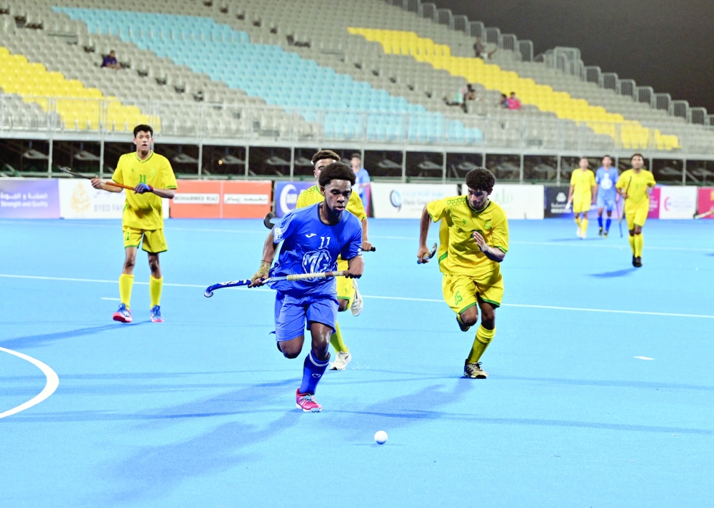 Seeb and Al Amerat players fight for the ball at Hockey Oman Stadium. — Hussein al Muqbali