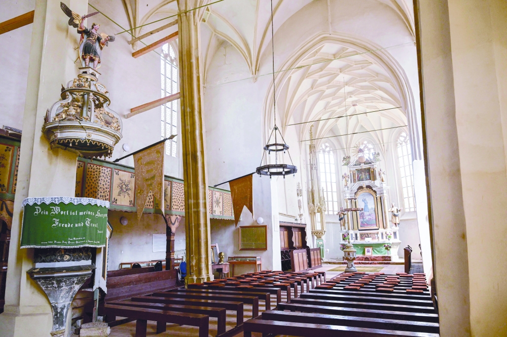 Interior view of the fortified church in the village of Mosna, Romania. — AFP