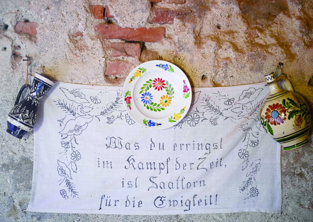 A motivational or religious proverb stitched onto a decorative wall cloth. — AFP