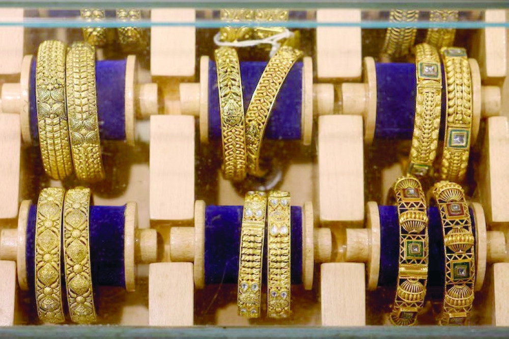 Gold pulls back after sharp rally as investors book profits.