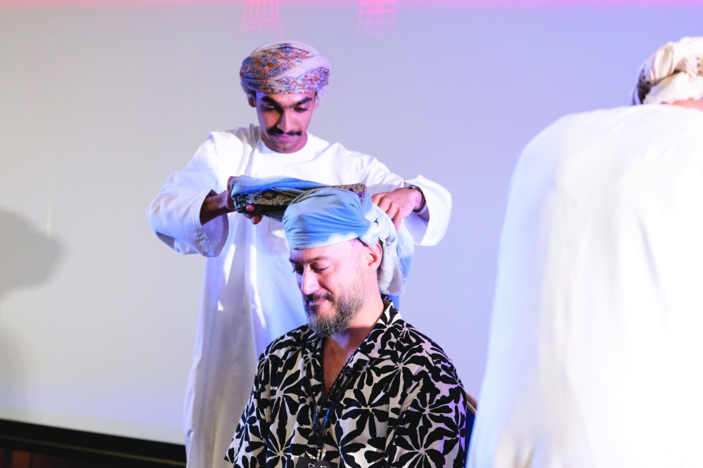 LIYSF Director Richard Myhill wears the traditional massar during the LIYSF's Traditions of Home.