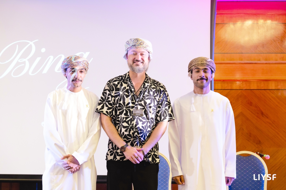 LIYSF Director Richard Myhill with Omani students in London.