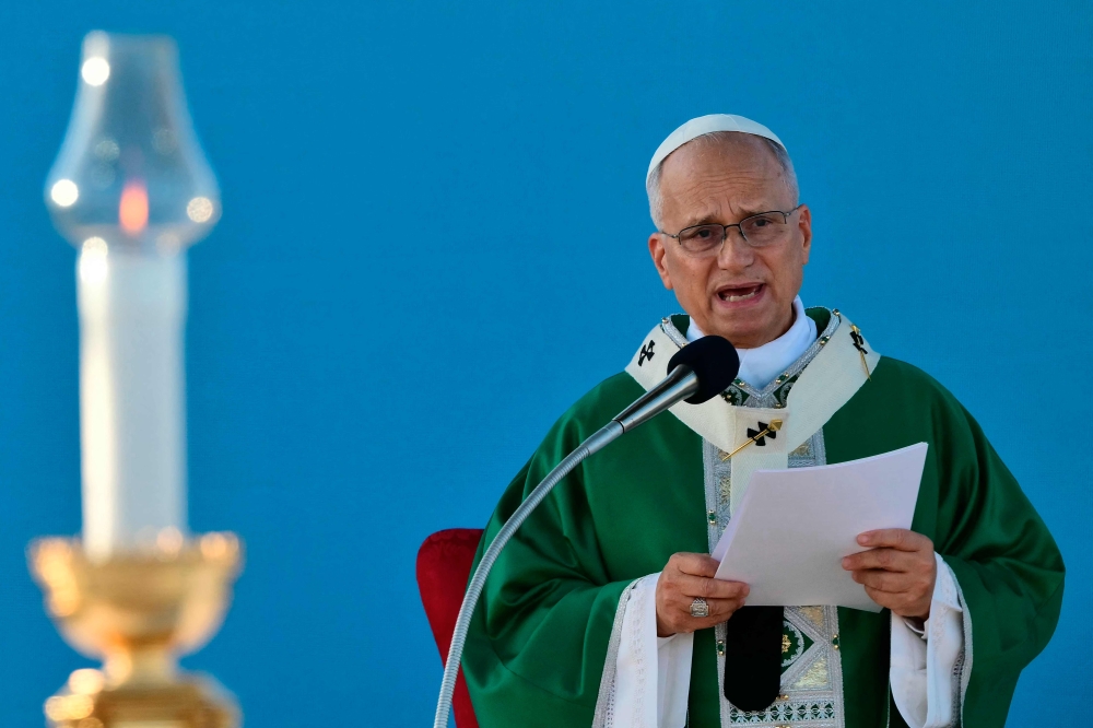 Pope Leo XIV leads a mass in the port of Rimini during a pastoral visit. — AFP
