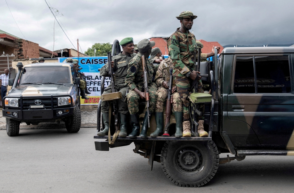 Members of the M23 rebel group ride on their vehicles in North Kivu province, Democratic Republic of the Congo. — Reuters file photo