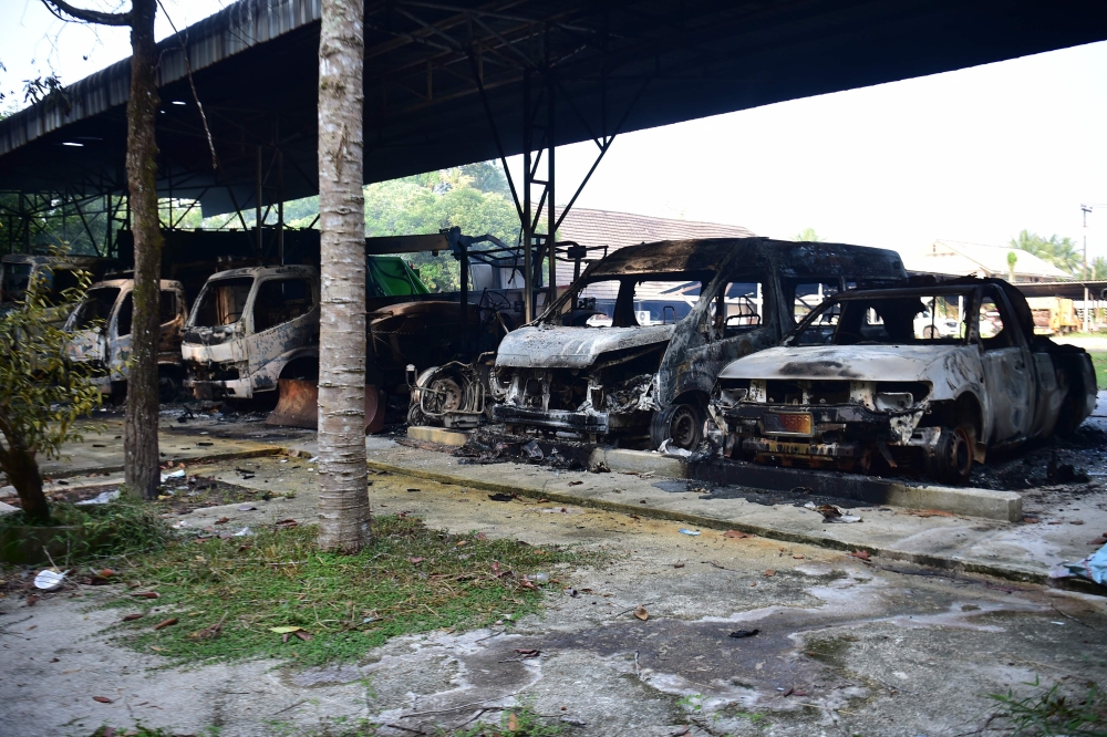 Charred vehicles are seen at the Bongor Subdistrict Administrative Organisation office in Ra-ngae district in the southern Thai province of Narathiwat. — AFP