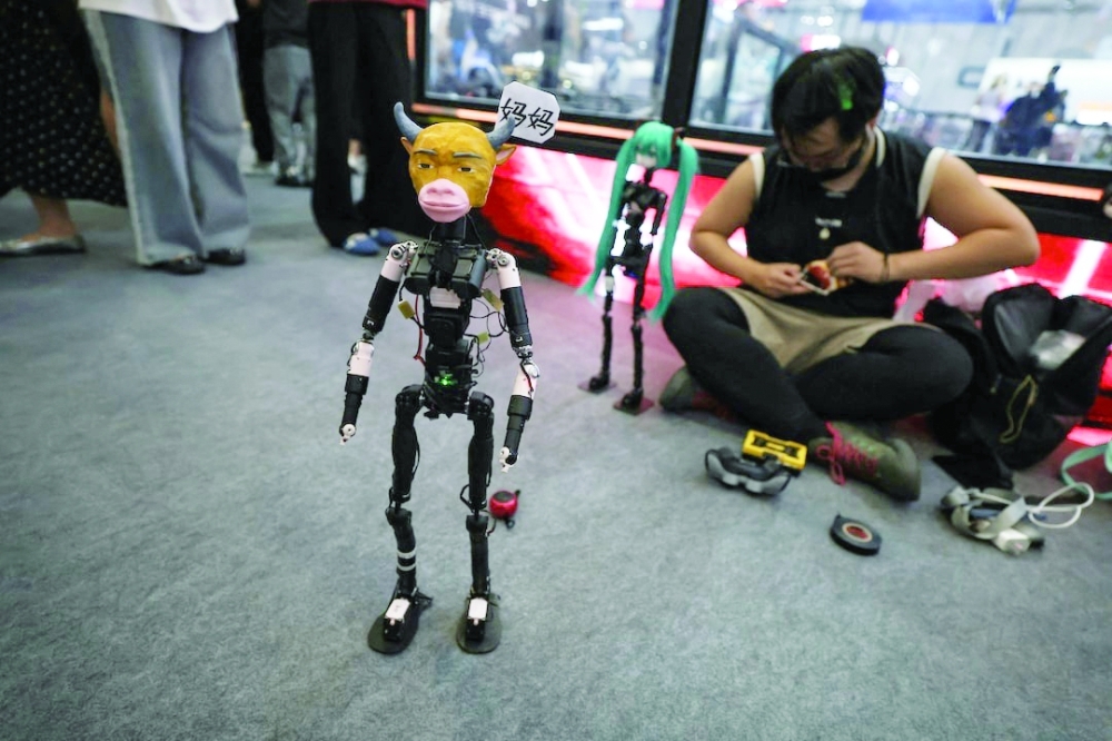 A robot with the head of Niu Lai, a character from a Chinese animated film Niu Lai, stands on the ground of an exhibition hall during the 2026 World Robot Conference in Beijing— Reuters
