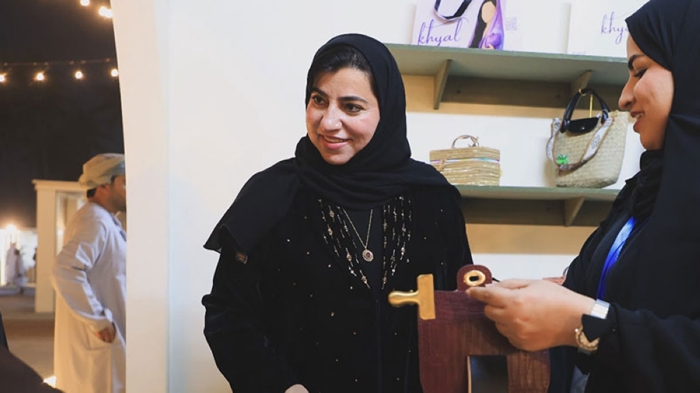 Her Excellency Halima bint Rashid Al Zari, the Chairperson of the Small and Medium Enterprises Development Authority (SMEDA), AKA Riyada, visiting the stall of Khadija Al Balushi's Khiyal brand.