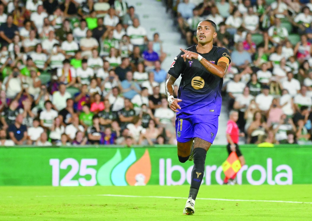 Raphinha celebrates scoring his team's first goal during the Spanish league. — AFP