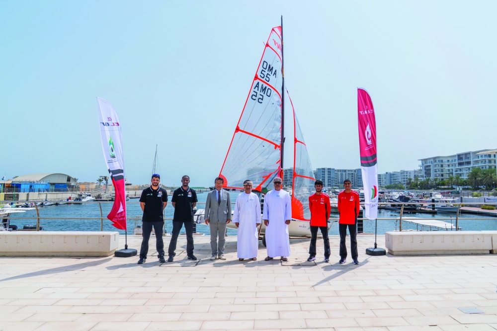 Group photo featuring Oman Sail’s sailing teams alongside representatives of the partners.