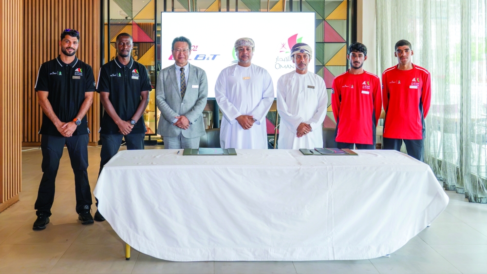 Group photo featuring Oman Sail’s sailing teams alongside representatives of the partners.