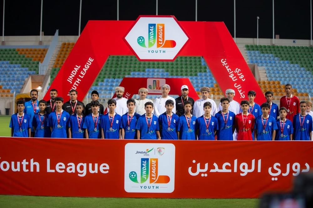 Al Nasr players receive the runners-up medals at the closing ceremony.