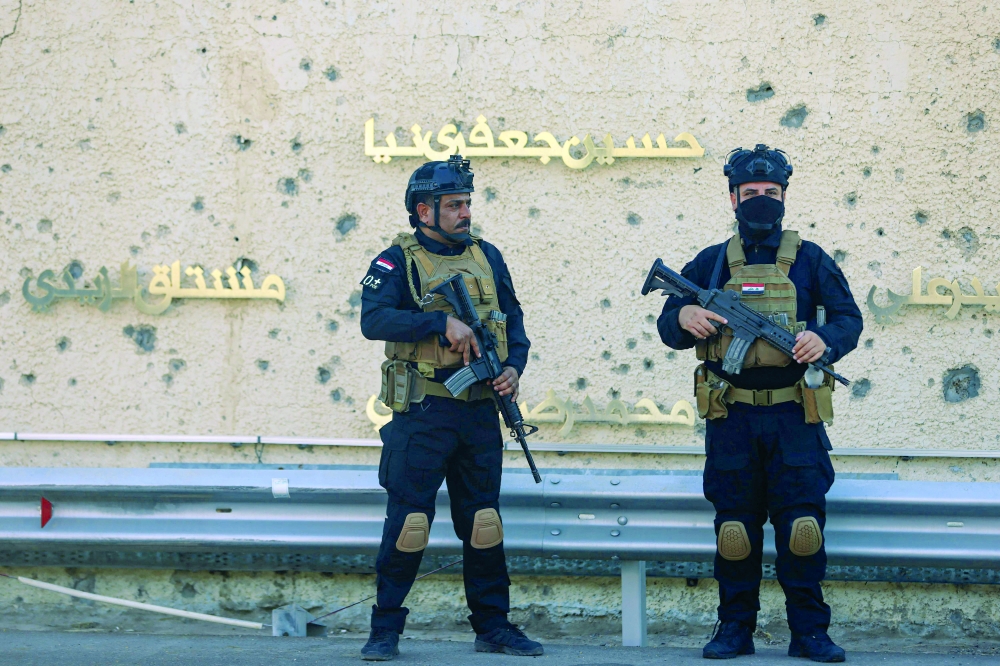 Iraqi special forces personnel secure the Baghdad International Airport road in Baghdad. — AFP