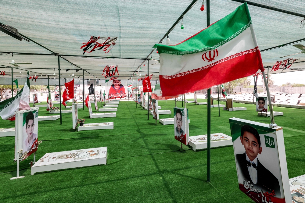 The graves of people and children killed during the strike on the Shajareh Tayebeh primary school are pictured at a cemetery in Minab in Iran’s Hormozgan province on August 10, 2026. 