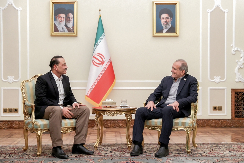 Iranian President Masoud Pezeshkian meets with chief of Defence Forces of Pakistan, Field Marshal Asim Munir, in Tehran, Iran, August 24, 2026. 