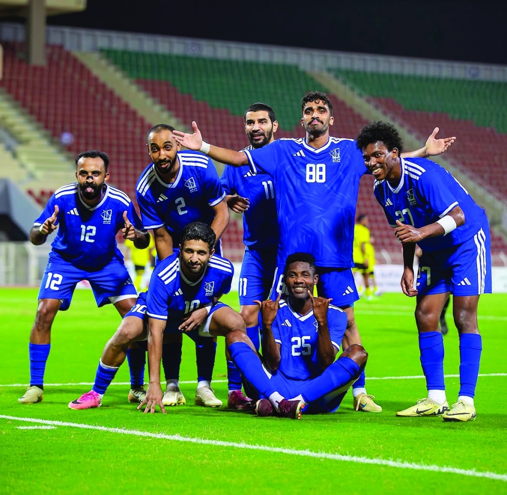 Sur players celebrate a goal during the match against Fanja.