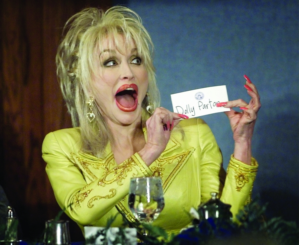 Country Music star Dolly Parton jokes with members of the National Press Club prior to her remarks March 23.