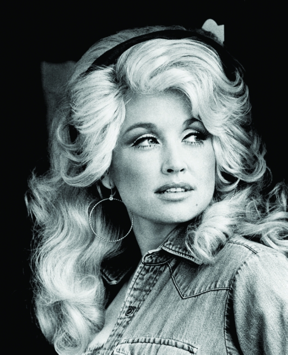 Dolly Parton poses during her long and celebrated career, becoming one of country music’s most recognisable stars.