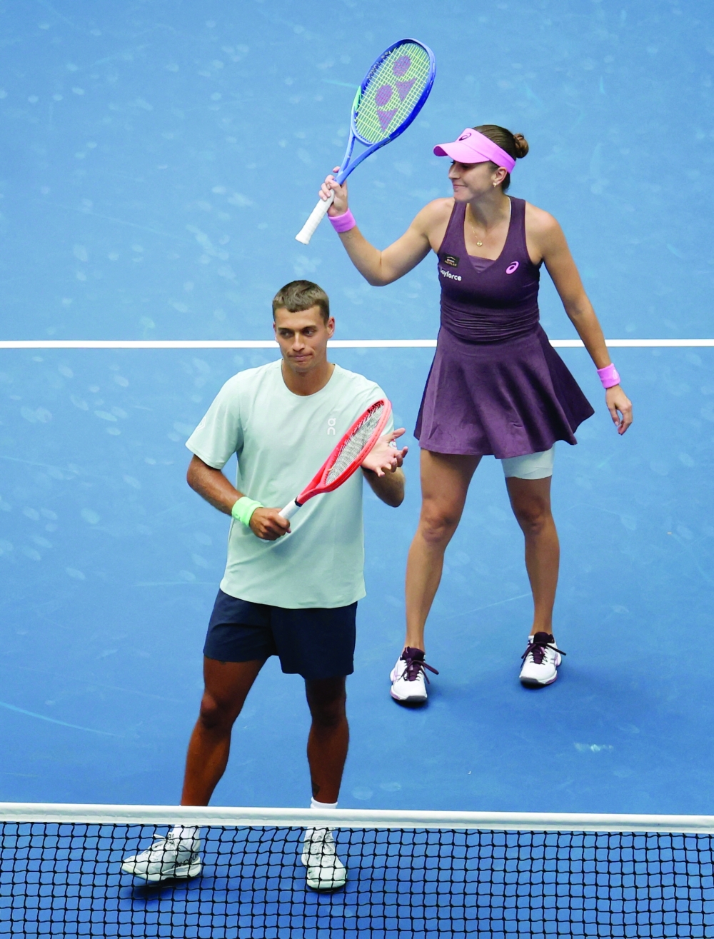 Switzerland's Belinda Bencic and Italy's Flavio Cobolli celebrate winning the mixed doubles quarter final match against Serena Williams of the US and Spain's Carlos Alcaraz. — Reuters