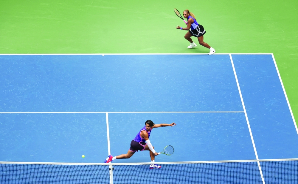Spain's Carlos Alcaraz in action during his mixed doubles quarter final match with Serena Williams of the US against Switzerland's Belinda Bencic and Italy's Flavio Cobolli. — Reuters