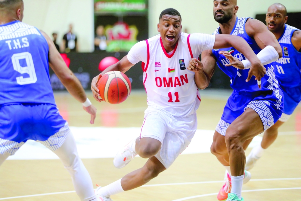 Oman player tries to break Kuwait defence in Dubai. — Faiza al Balushi