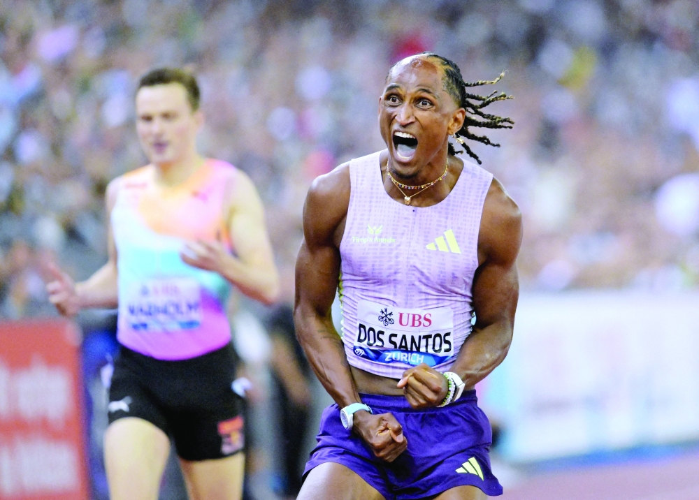 Brazil's Alison dos Santos celebrates after winning the men's 400m hurdles final and setting a new world record REUTERS