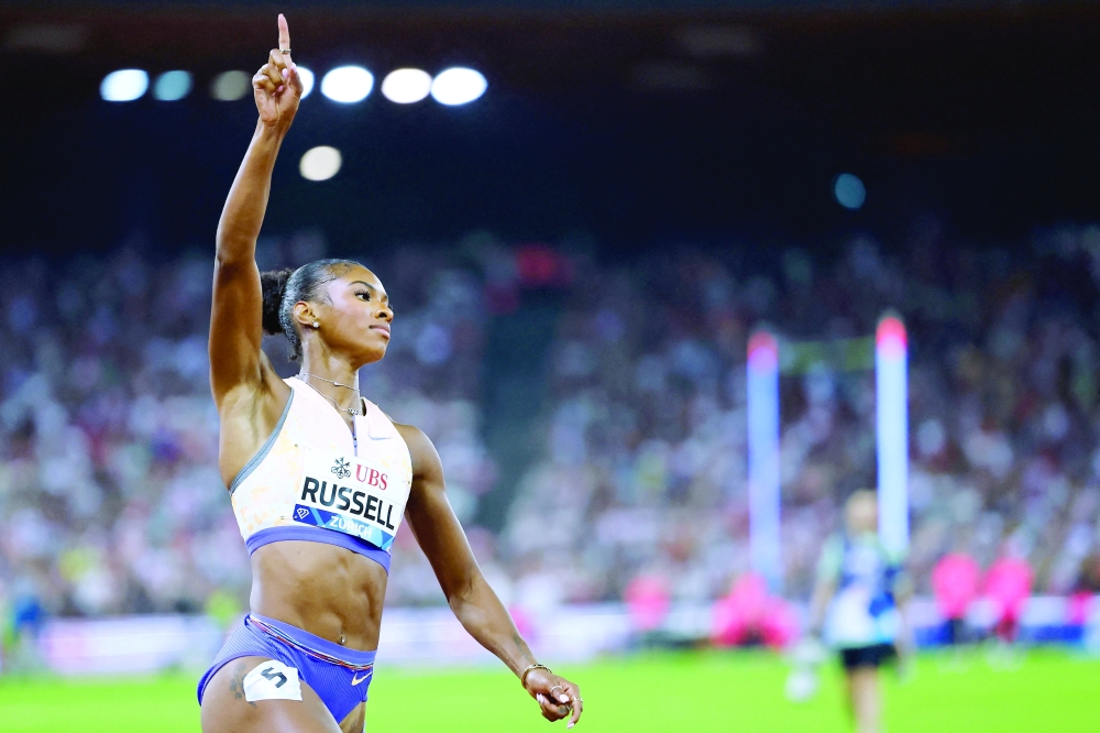 TOPSHOT - US' Masai Russell celebrates as she crosses the finish line to win the women's 100m hurdles and breaks the world record during the IAAF Diamond League athletics meeting, at the Letzigrund Stadium, in Zurich on August 27, 2026. (Photo by Stefan Wermuth / AFP)
