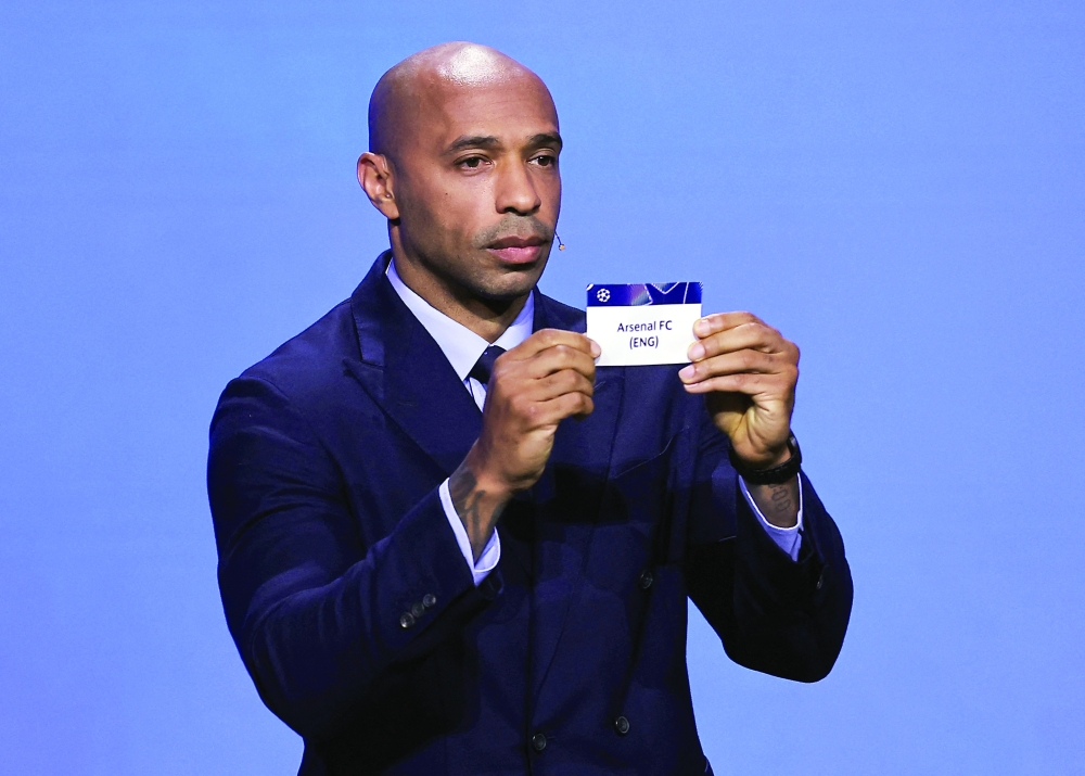 Former footballer Thierry Henry draws Arsenal during the Uefa Champions League league phase draw at Grimaldi Forum, Monaco. — Reuters