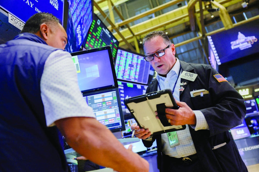 A trader works on the floor of the New York Stock Exchange in New York City, US. - Reuters File