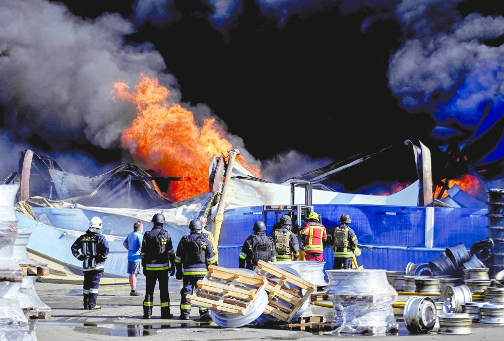 Firefighters work at a site of a Russian drone strike, amid Russia's attack on Ukraine, in Kyiv. — Reuters