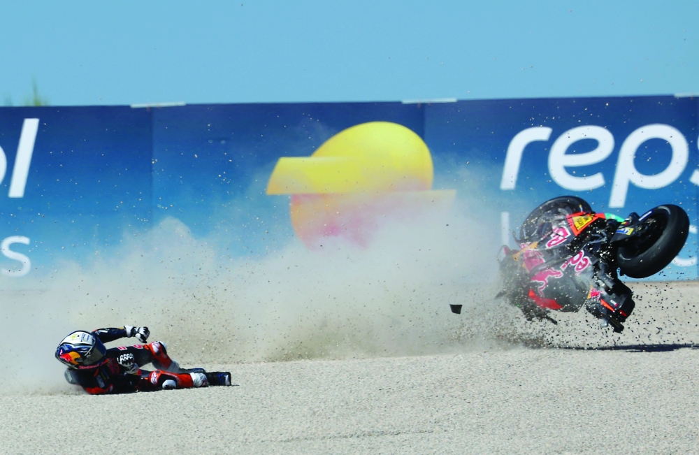 Team Red Bull KTM Factory Racing's Pedro Acosta crashes during the qualifying session of the MotoGP Aragon Grand Prix at the Motorland circuit in Alcaniz, northeastern Spain. — AFP