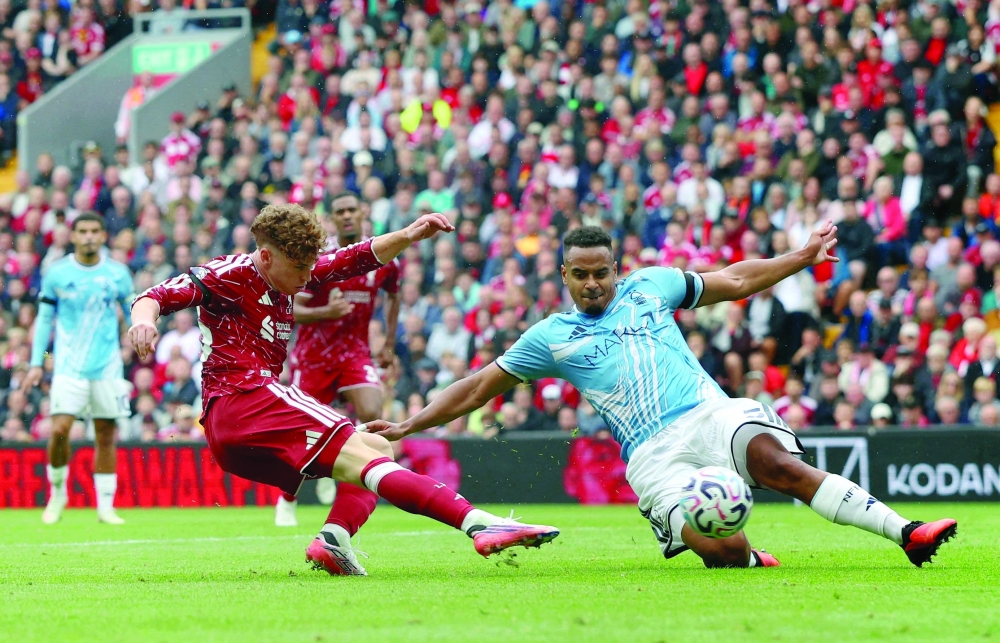 Liverpool's Victor Munoz scores their second goal against Nottingham Forest at Anfield. — Reuters