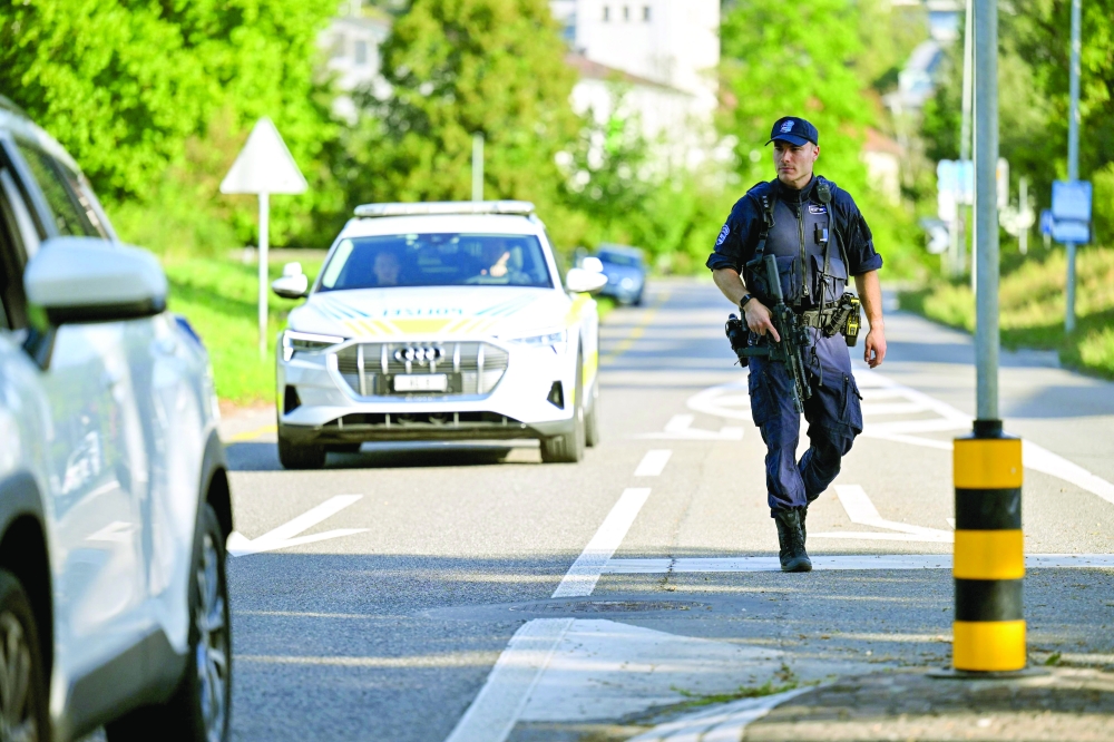 Police officers secure the area where a shooting occurred, in Aarau, northern Switzerland. — AFP