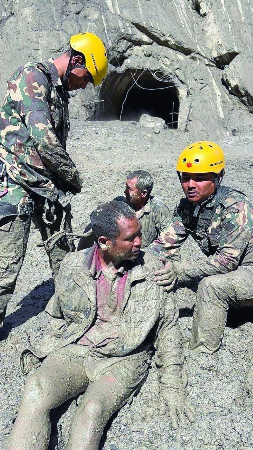 Nepal Army personnel rescue a man following deadly flash floods and mudslides, in Rasuwa, Nepal. — Reuters