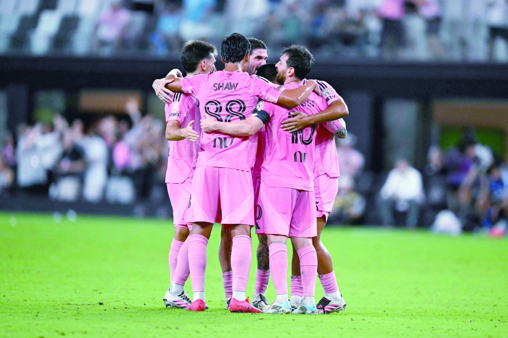 Lionel Messi celebrates with his teammates after his team scored a goal during the Major League Soccer. — AFP