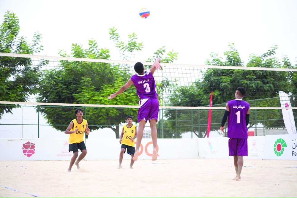 A beach volleyball match in progress during the fifth Oman Schools Beach Sports Championship in Dhofar. — Yousef al Siyabi