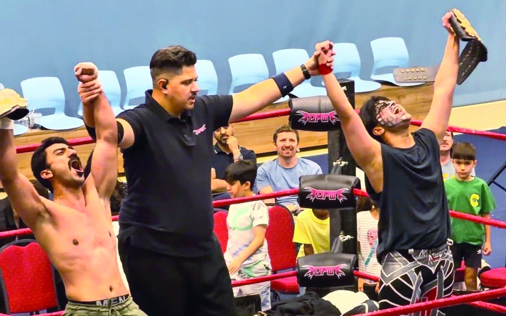 Anas Rex and his partner Sam X during the QPW Tag Team Championship in Doha, Qatar.
