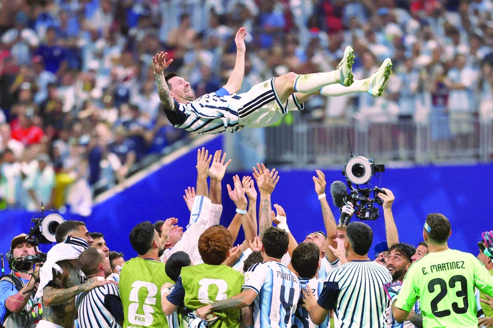 Lionel Messi celebrates with teammates after winning the 2026 World Cup round of 16 football match