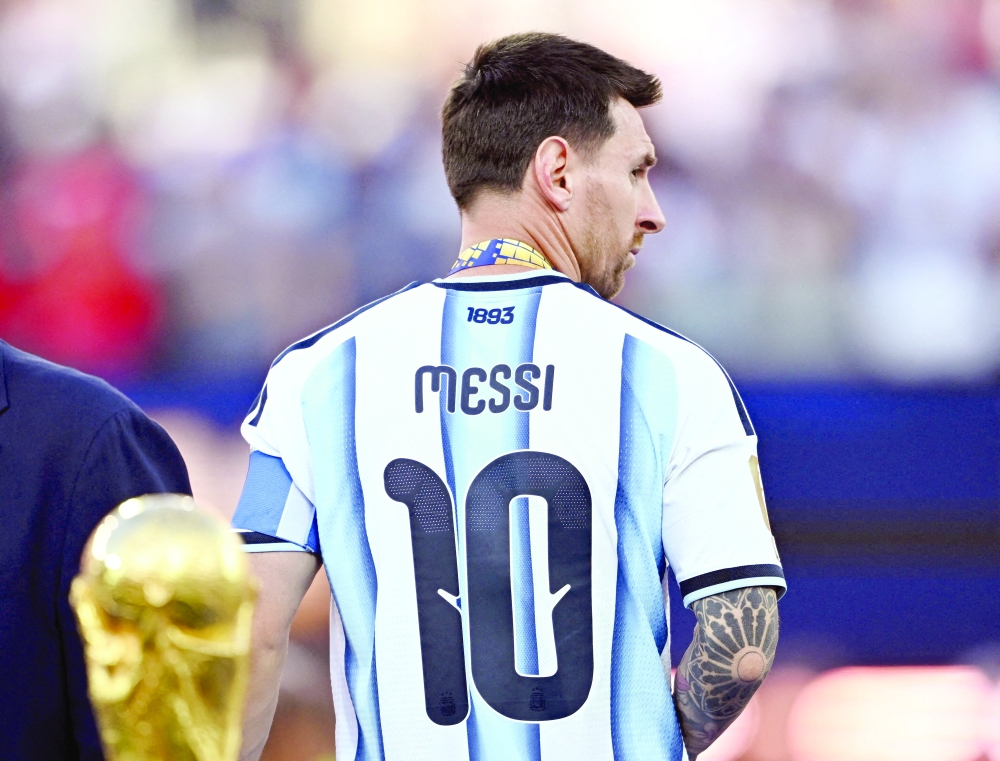 Argentina's Lionel Messi looks dejected after receiving his runners up medal on the podium after losing the World Cup Final