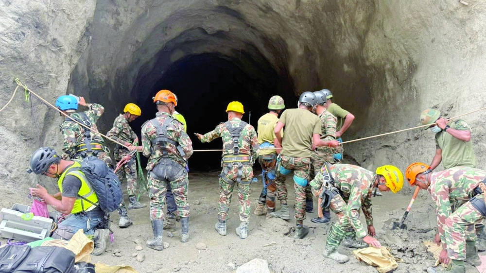 Nepal army personnel work during a search and rescue operation near the Trishuli Hydropower Project site in Rasuwa district, Nepal. — AFP