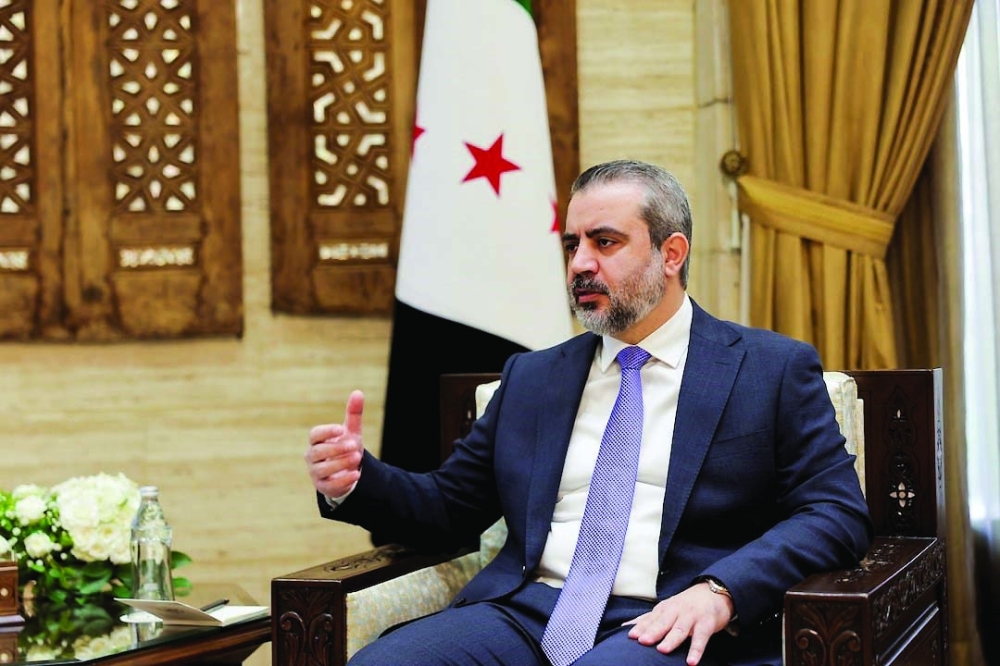 Syrian FM Asaad al Shaibani, speaks during an interview in Damascus. — Reuters